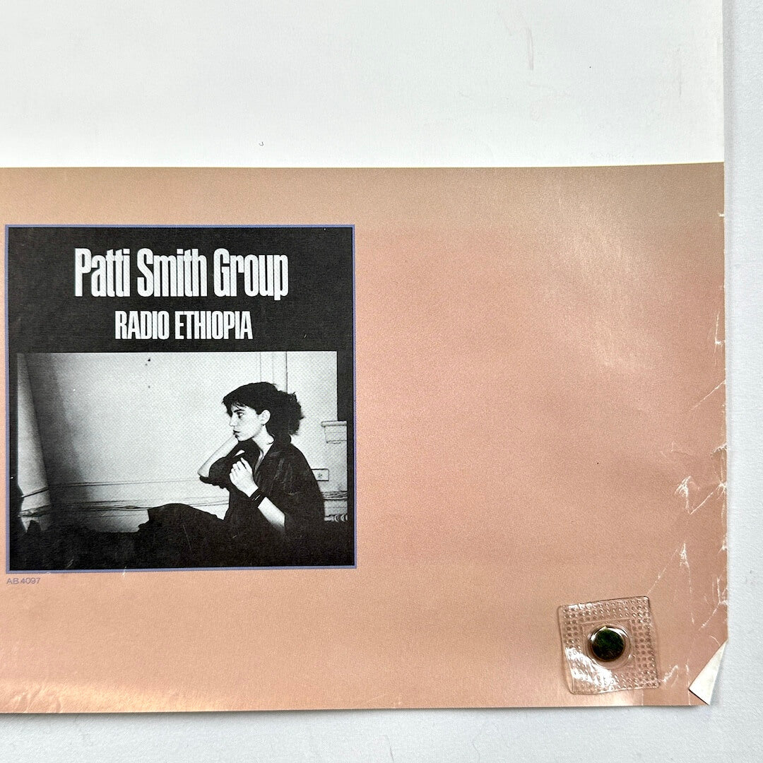 Bottom right corner with crease at corner and edge wear.