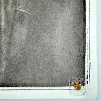 Bottom right corner in good condition, showing copyright information. 