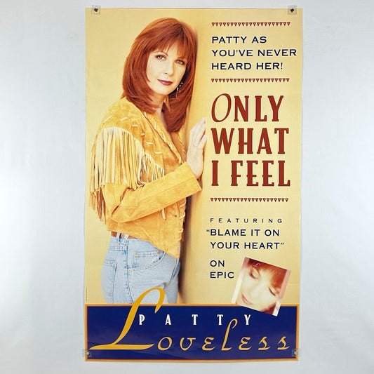 Poster for Patty Loveless with woman in tan leather jacket leaning against wall. 