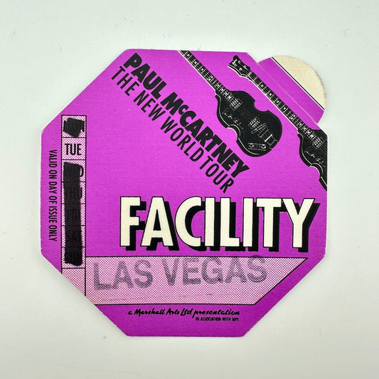 A vintage Paul McCartney 'The New World Tour' Facility Las Vegas event ticket from 1972, featuring a purple octagonal design. 