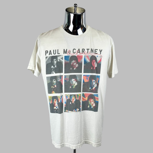 White t-shirt with McCartney's name at top with nine black/white images of artist below with colored Union Jacks superimposed.