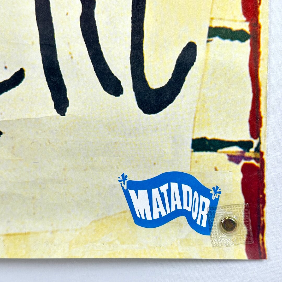 Bottom right corner of poster with Matador logo. 