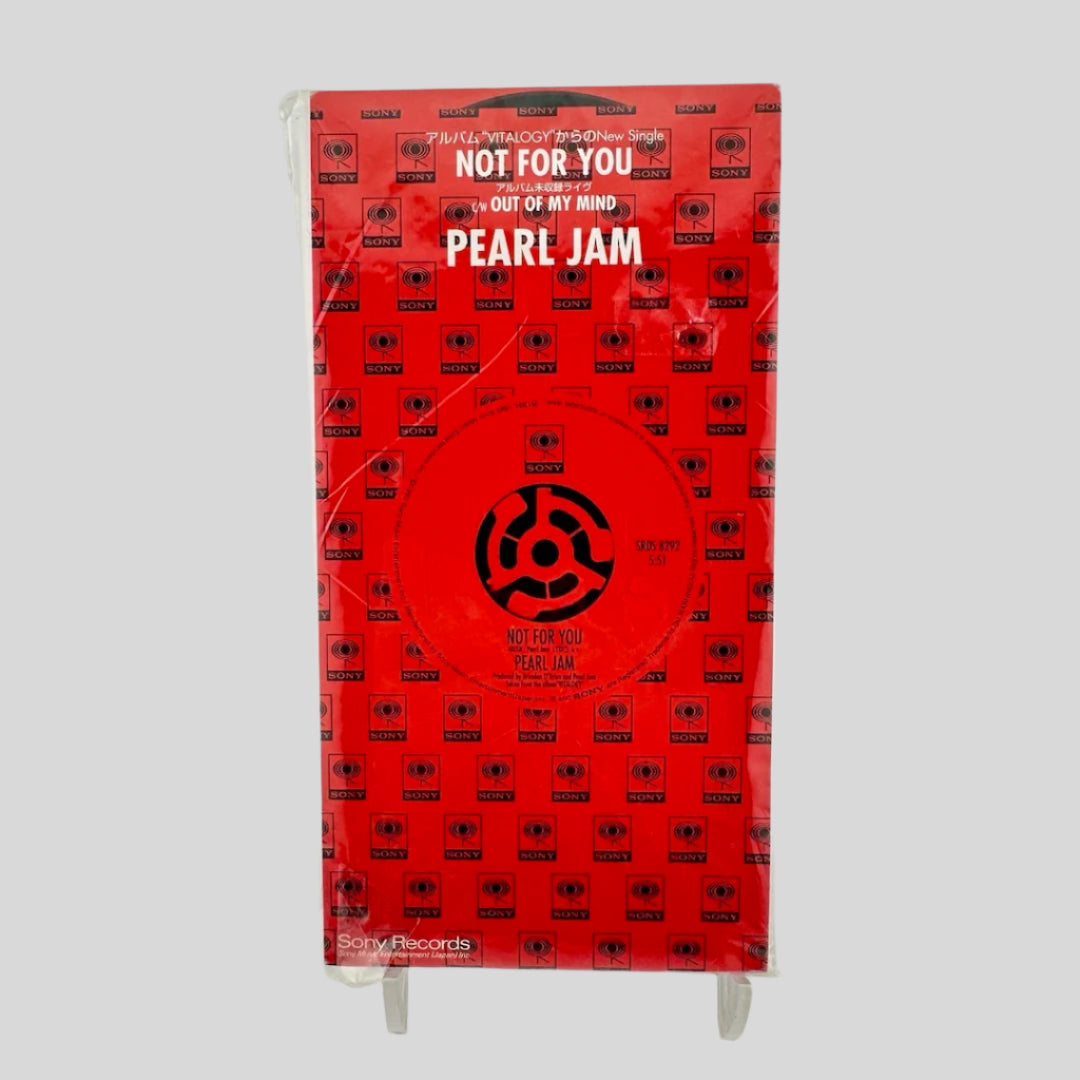 Red packaging with black text & symbols. White text for main title & artist information in Japanese & English.