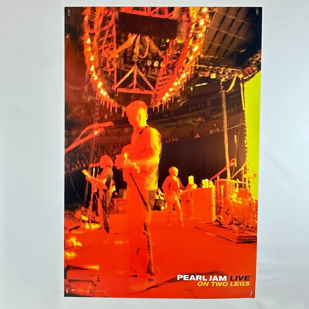 Poster of a concert with 'Pearl Jam Live on Two Legs' text.