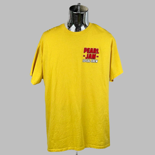 Front of yellow short sleeve shirt with "PEARL JAM" in red text on right breast above "Local Crew" in white.