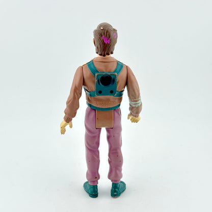 Action figure with a brown jacket, pink pants, and teal shoes on a white background