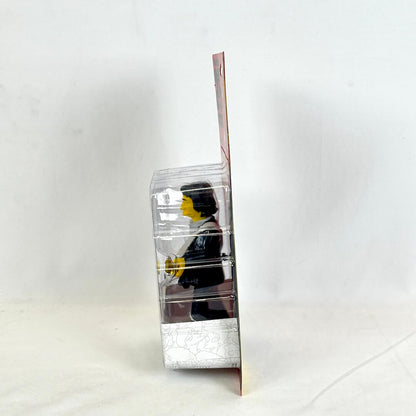 Clear plastic packaging with a small figure inside on a white background