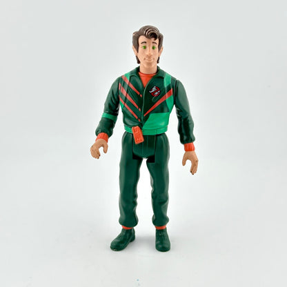 Action figure in green and red outfit on a white background