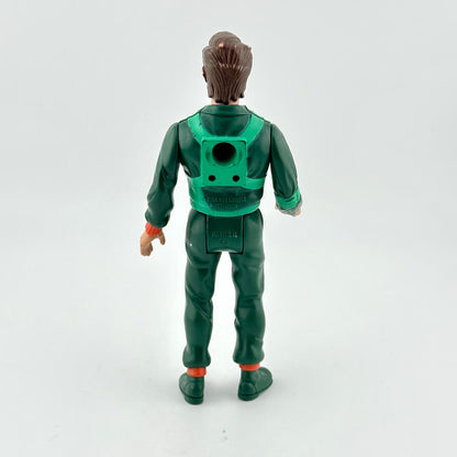 Toy figure in green outfit with backpack on a white background