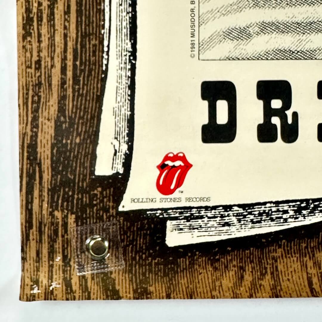 Bottom left corner of poster with pin holes and Rolling Stones Records logo. 
