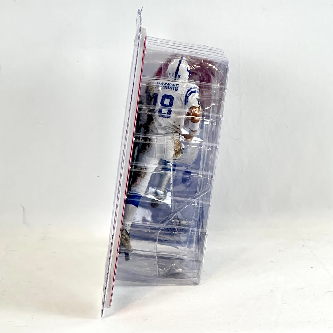 Action figure in a clear packaging on a white background