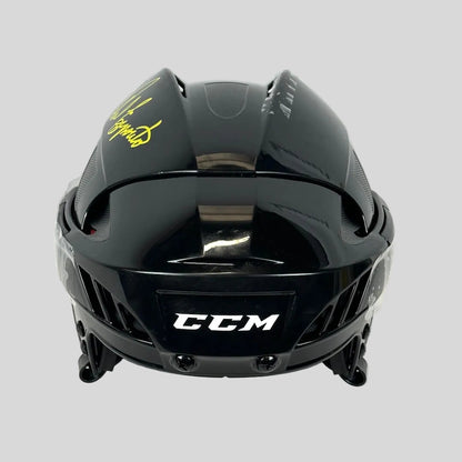 Black CCM hockey helmet on a white background