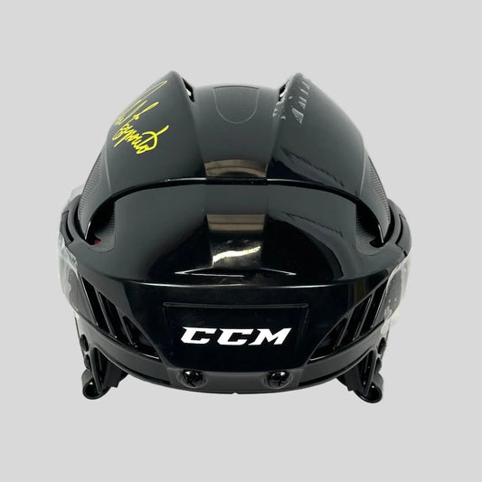 Black CCM hockey helmet on a white background