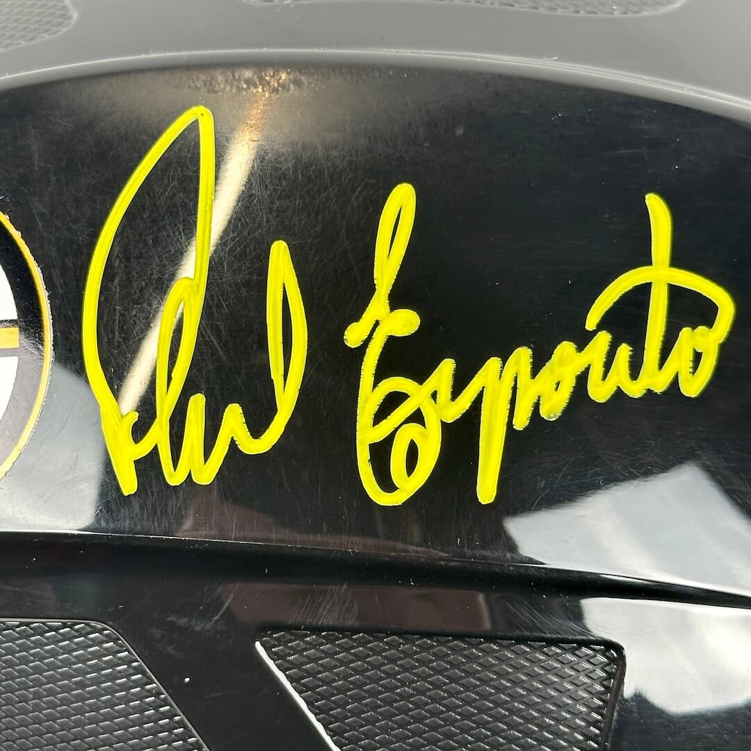 Yellow signature on a black surface