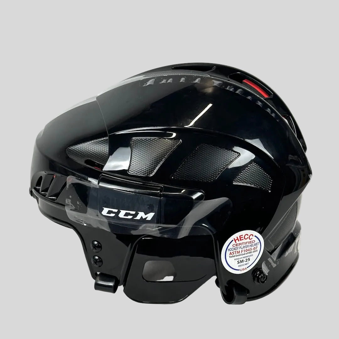 Black hockey helmet with CCM branding on a white background