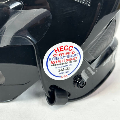 HECC certified hockey player helmet with certification label on a black helmet.