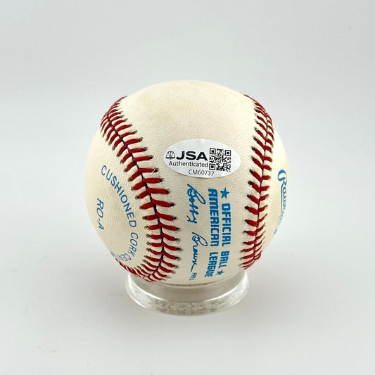 Baseball with JSA authentication sticker on a white background