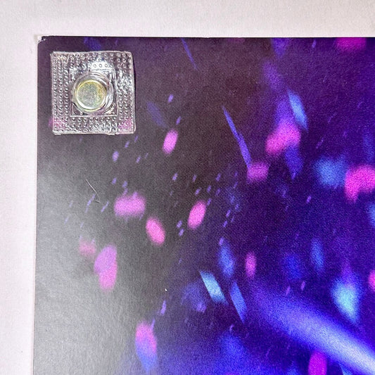 Top left corner of poster with some damage. 
