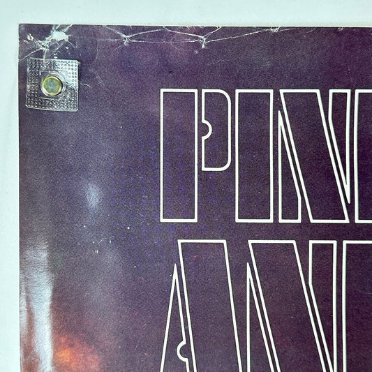 Top left corner of poster with pin holes and wear. 