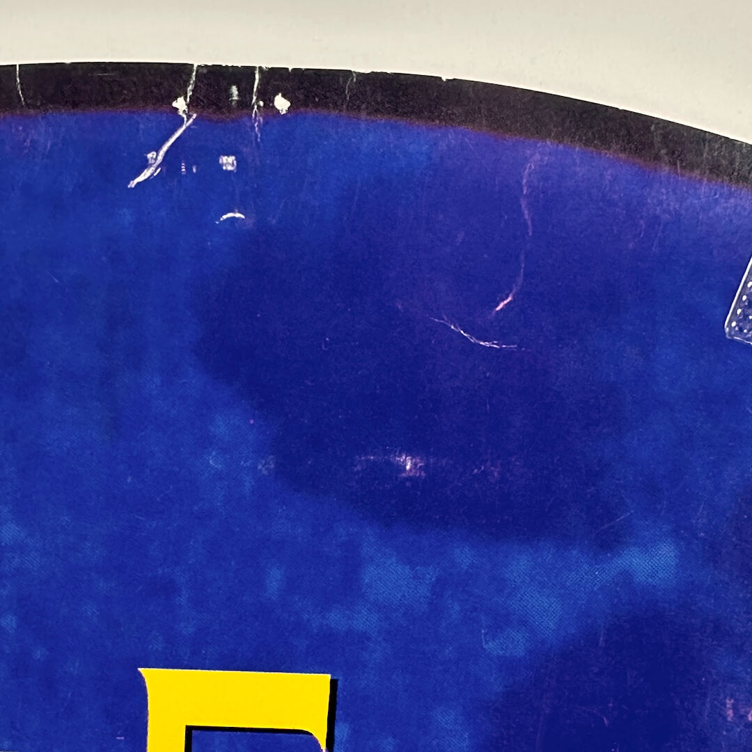 Top of circle with pin holes and creases.