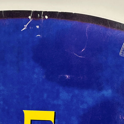 Top of circle with pin holes and creases.