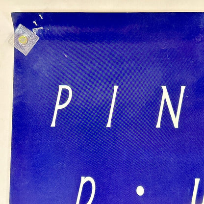 Top left corner with pin holes. 