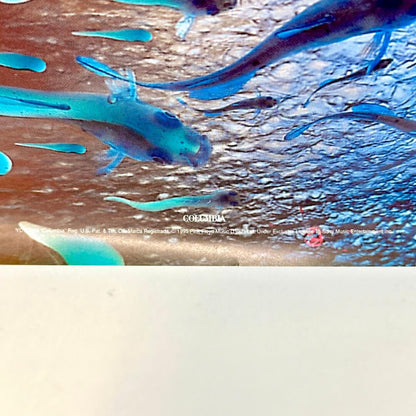 Bottom center of poster with copyright info. 