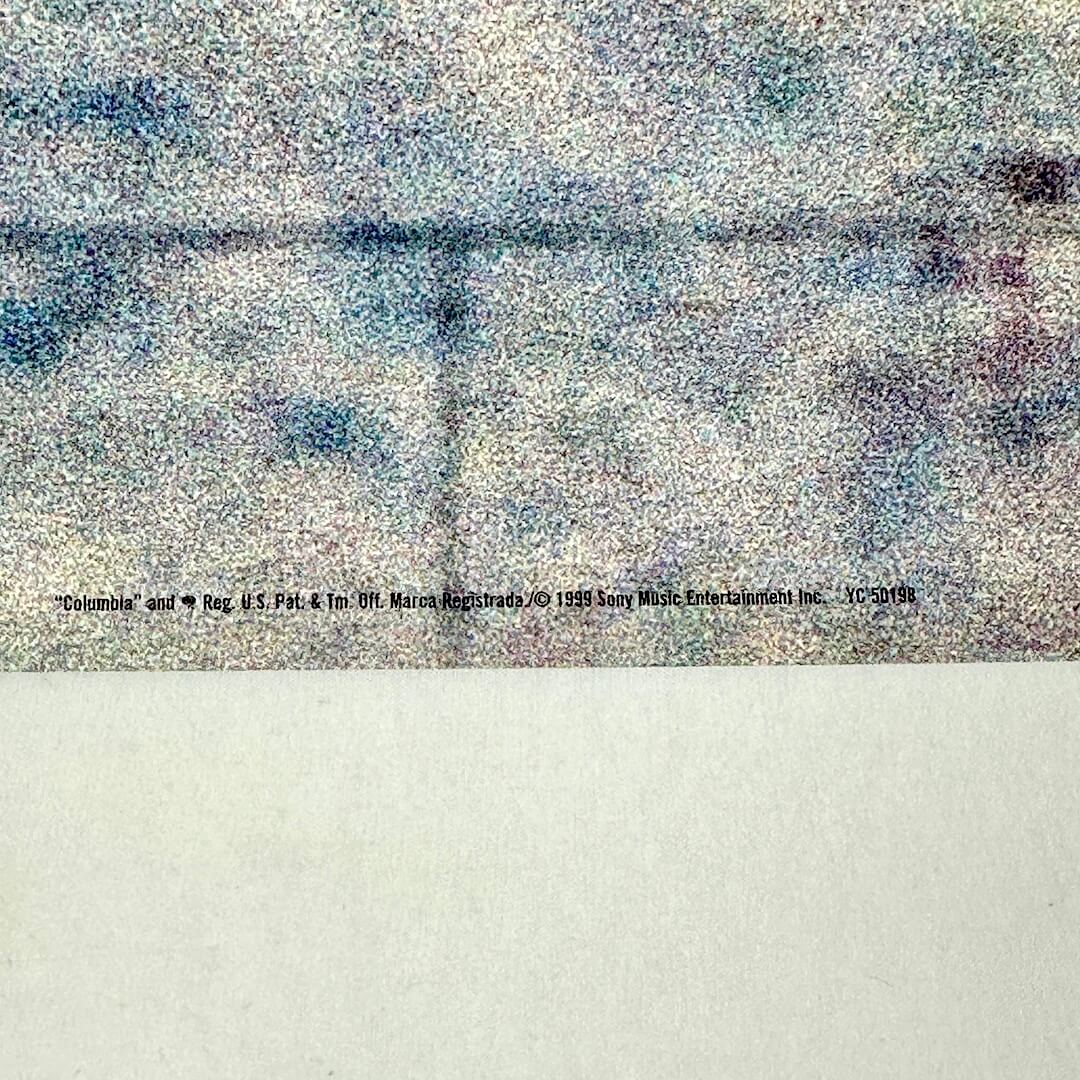 Bottom center of poster with copyright info.