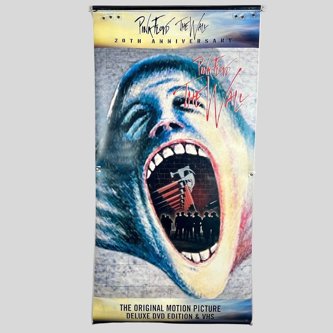 Vinyl banner for Pink Floyd The Wall with artistic album cover art and text at top and bottom.