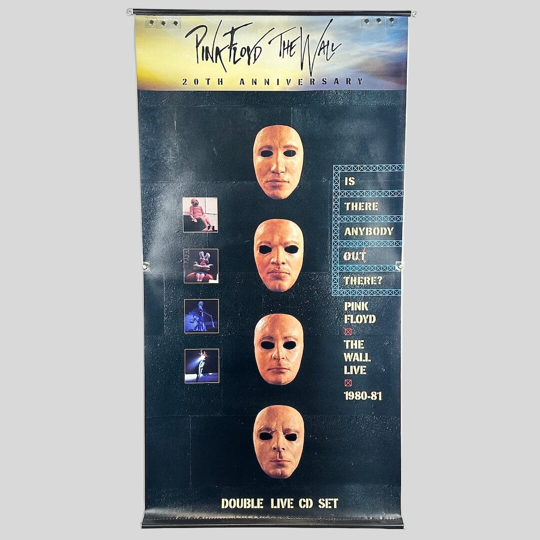 Reverse side of banner with face masks down center and text on all sides. 