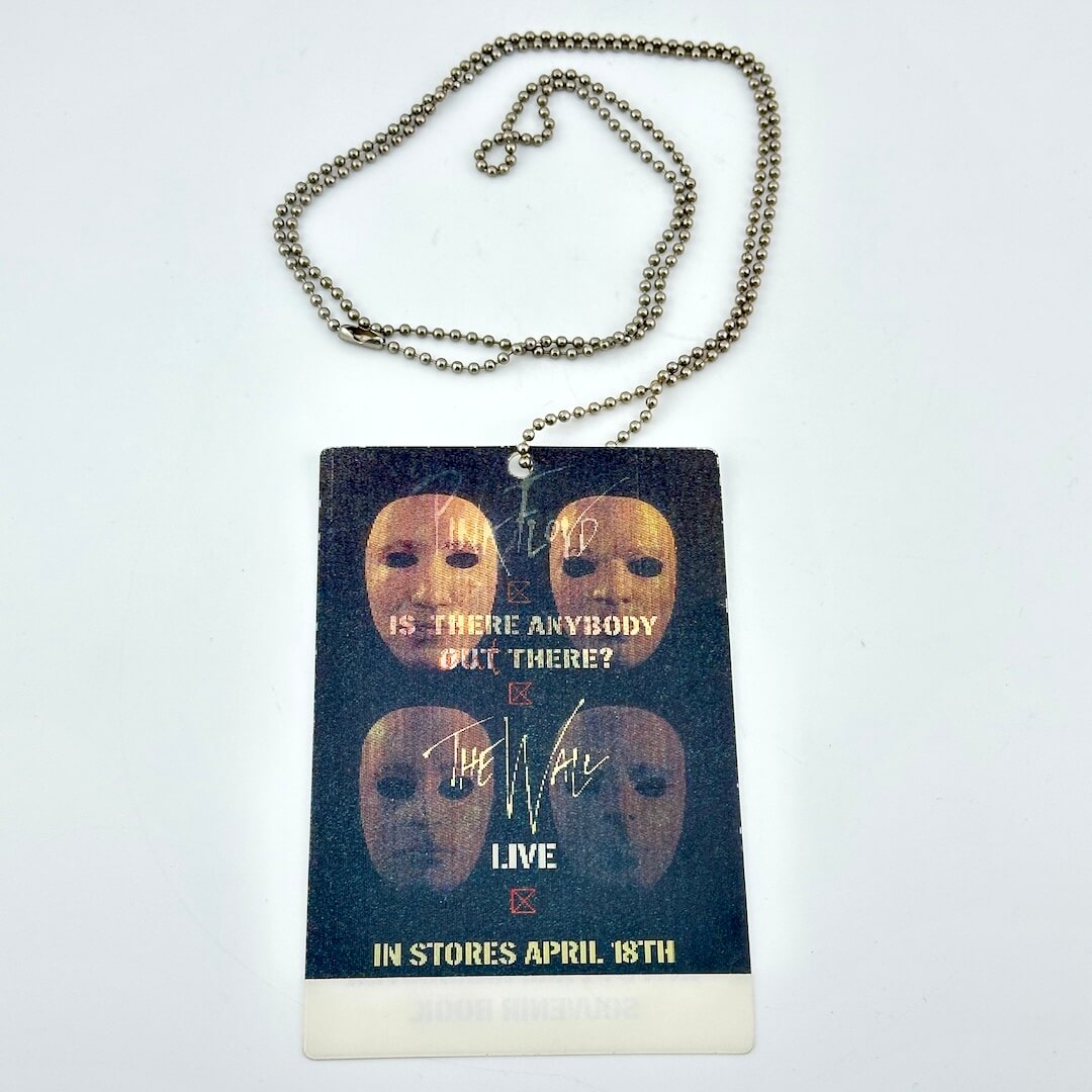 Promotional laminate with masks and text on a chain against a white background