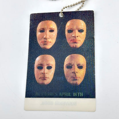 Card with four masks on a dark background, featuring text 'IN STORES APRIL 18TH"