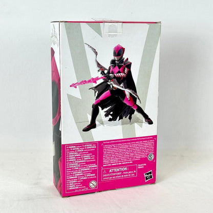 Back of packaging with image of posed action figure above warnings and product information. 