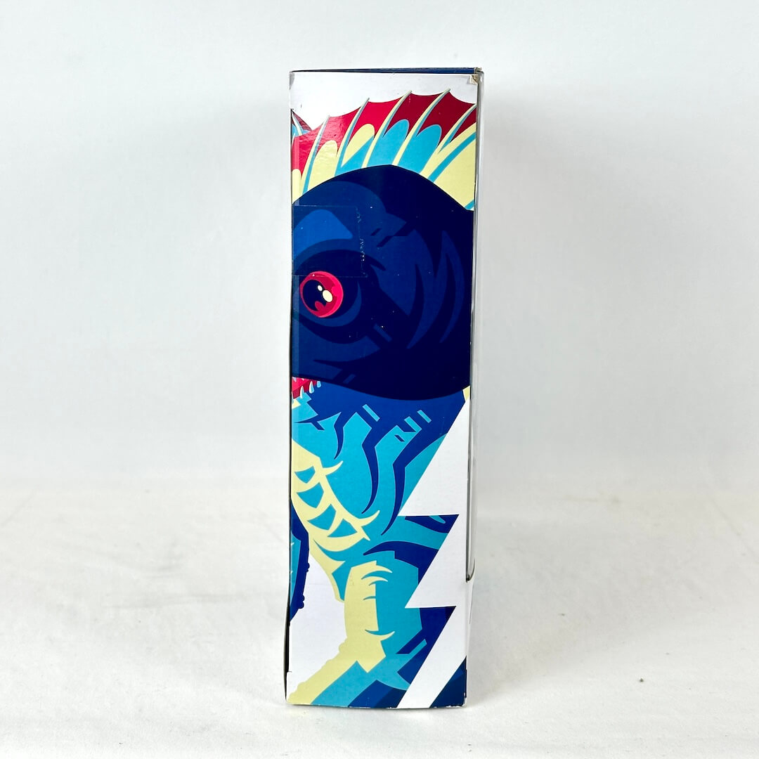 Side view of packaging with illustration of character in bright colors. 