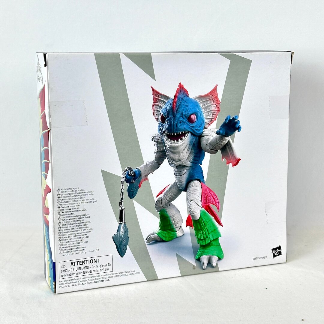 Back view of packaging with illustration of assembled toy with warning label. 