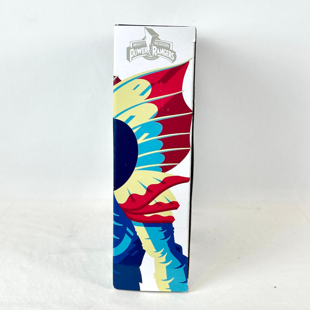 Side view of packaging with brightly colored illustration of character under Power Rangers logo. 