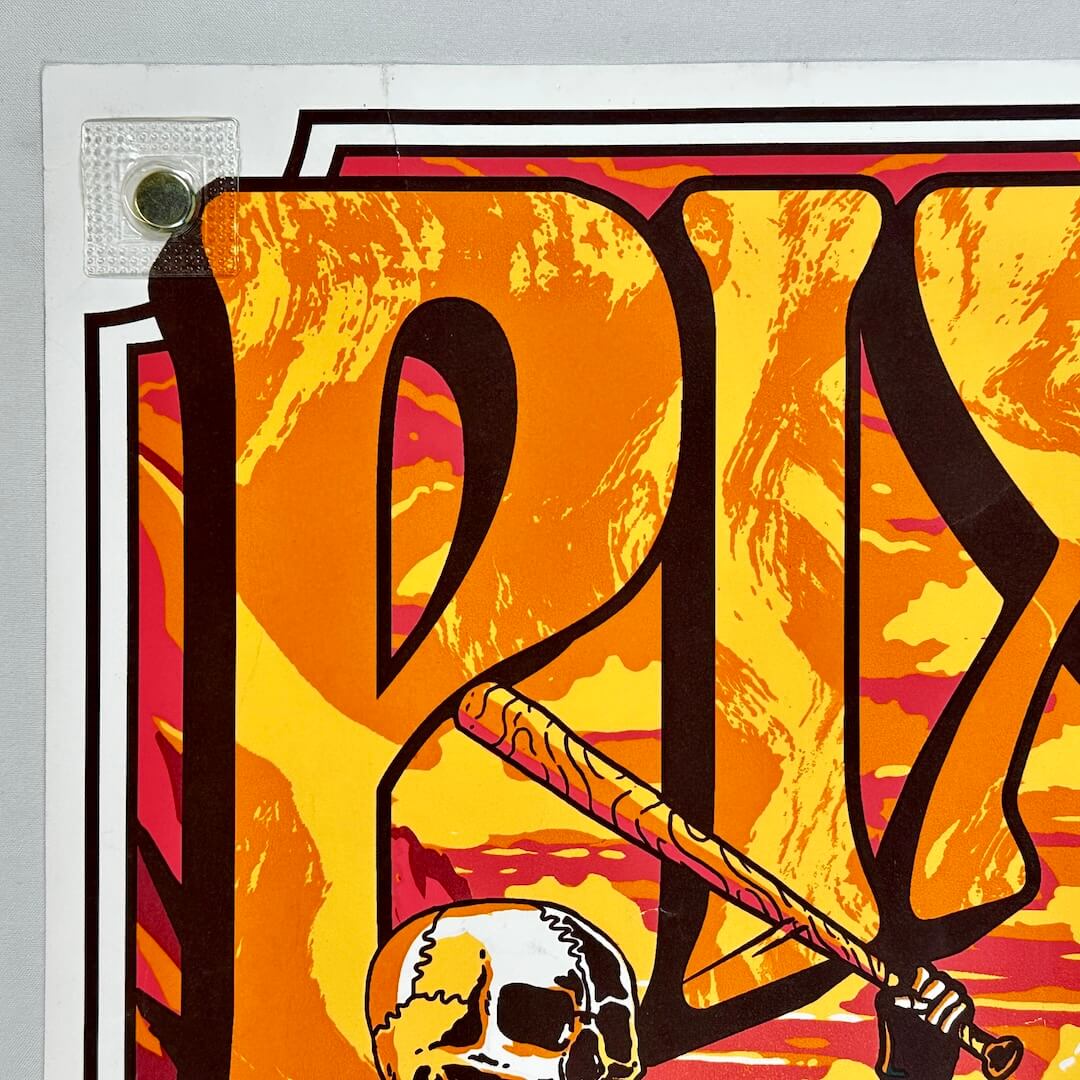 Colorful graphic design with abstract shapes and a skull on a yellow background