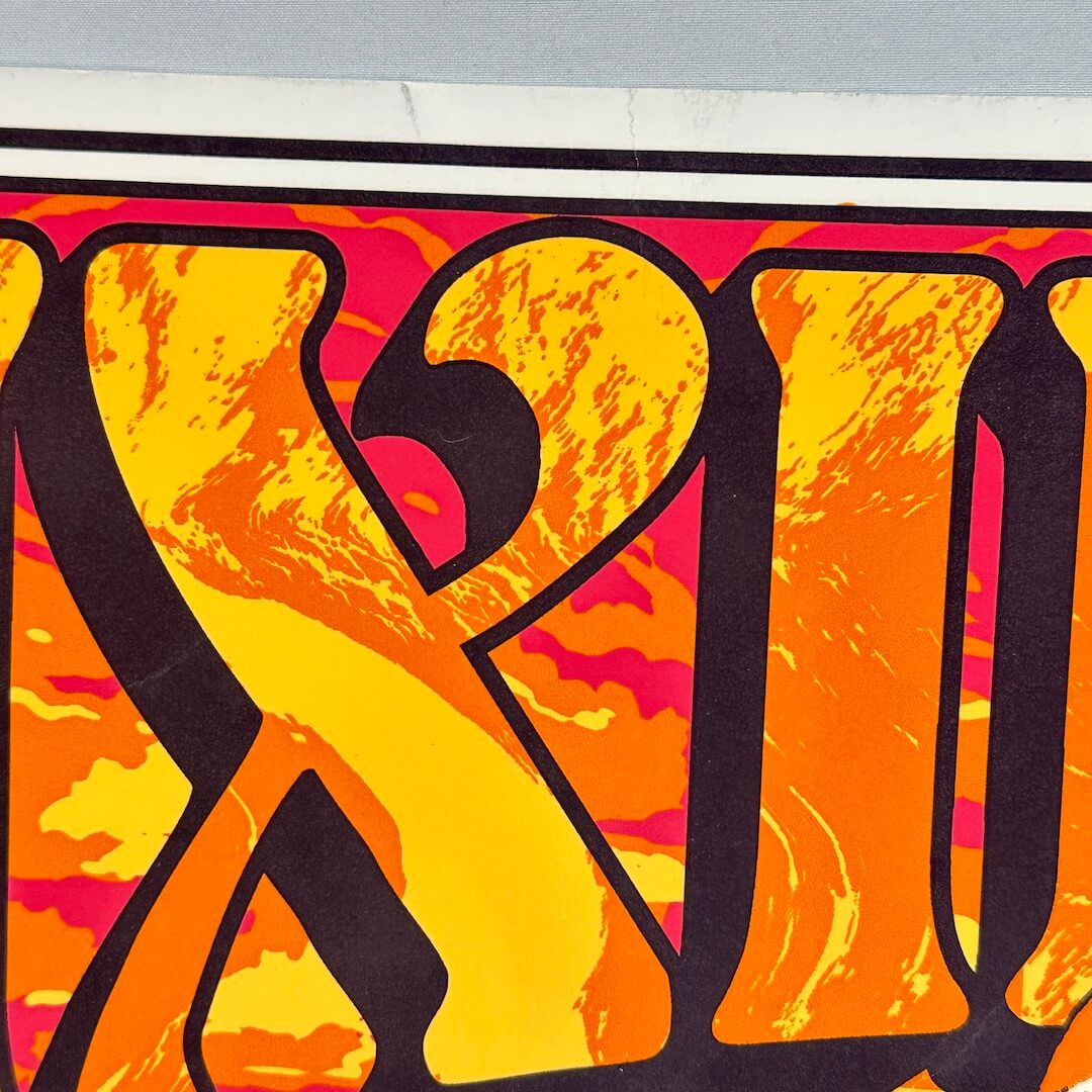 Colorful abstract design with black outlines on a pink and orange background