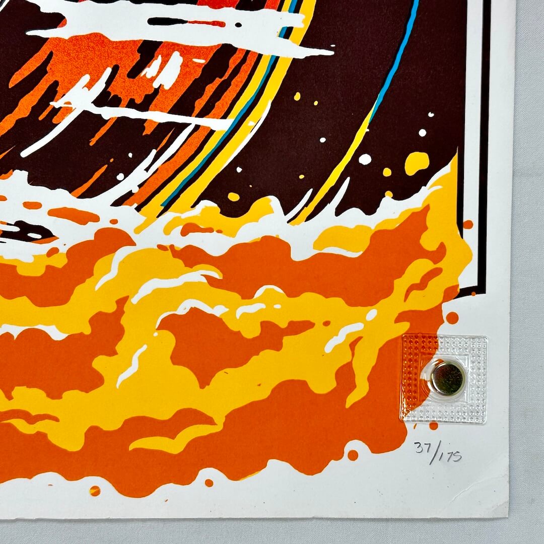 Colorful abstract art print with orange, yellow, and black on a gray background