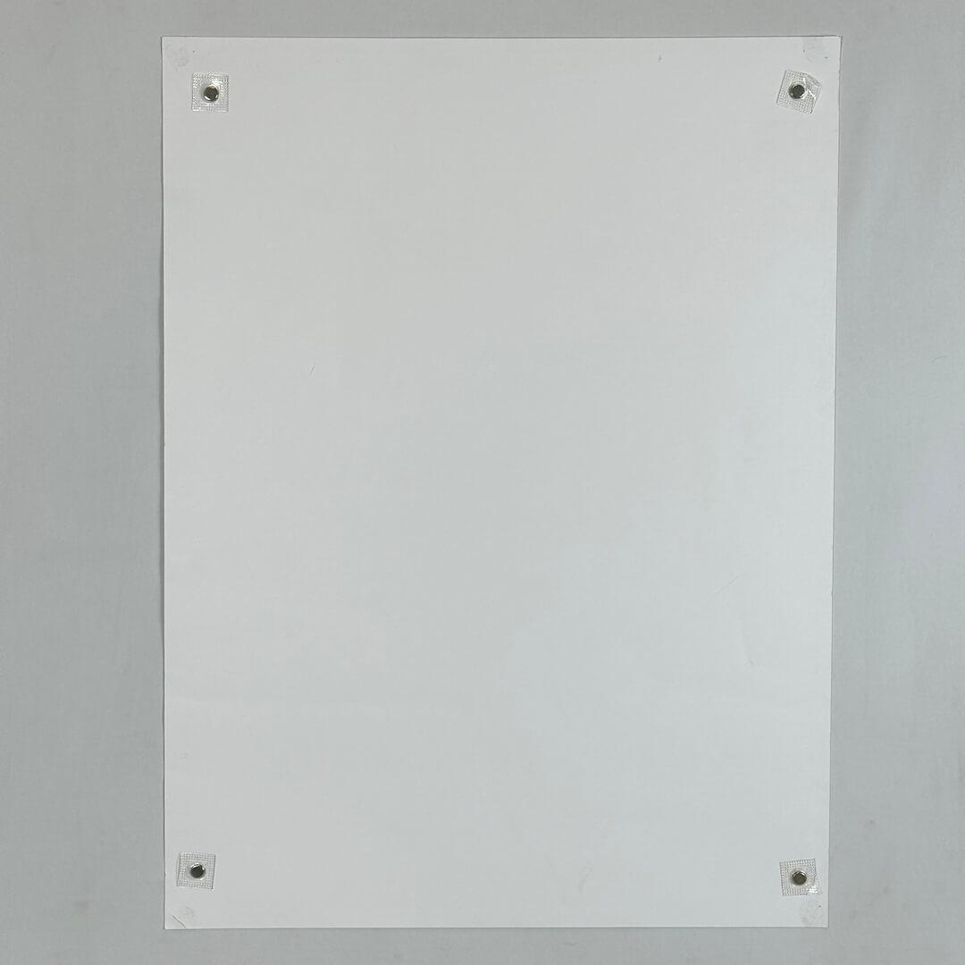Backside of poster against white background. 