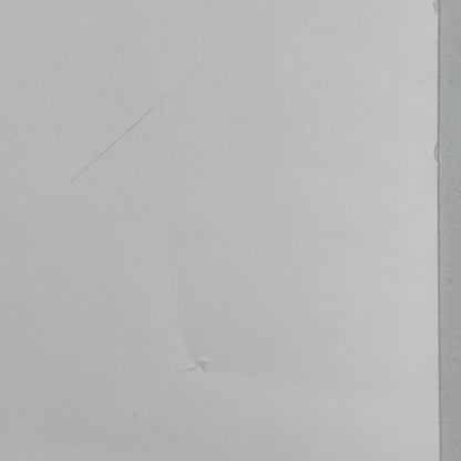 Close up of dent on side of poster. 