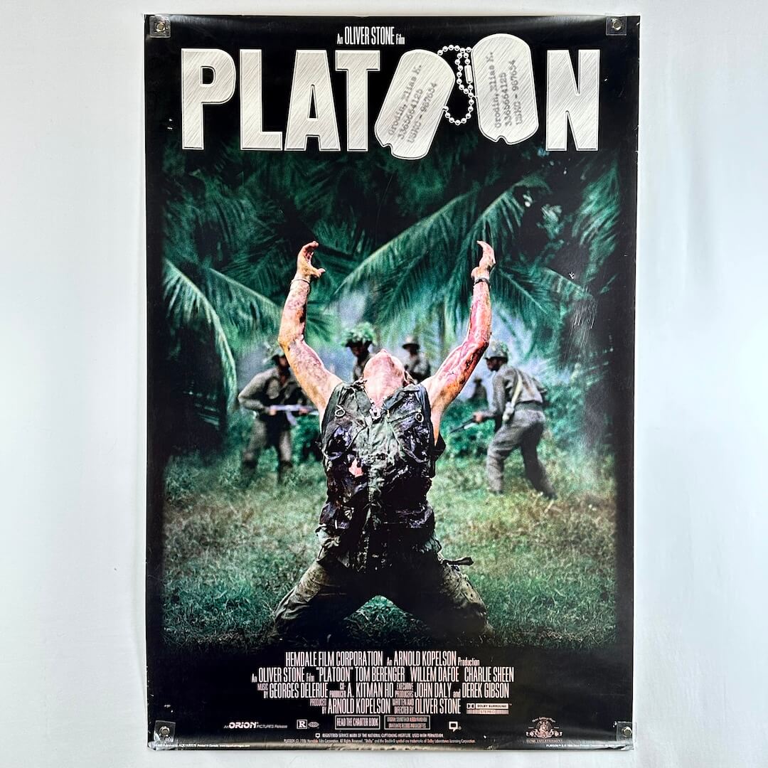 Movie poster for 'Platoon' with a soldier in a jungle setting.