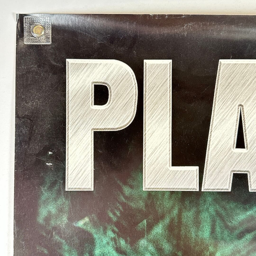 Top left corner of poster with rolled corner and some edge wear.