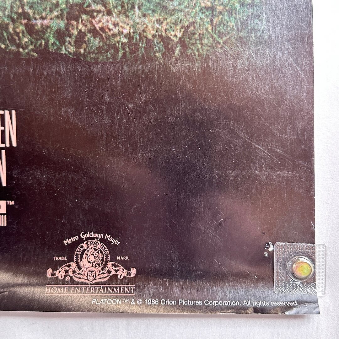 Bottom right corner with copyright information and rolled corner. 