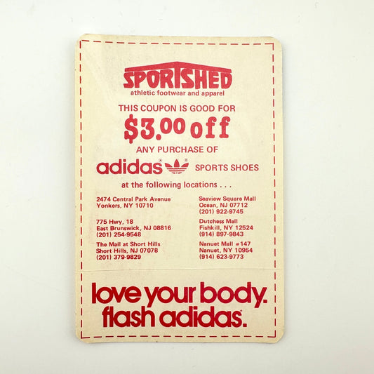 Back of pass with an ad and coupon printed in red. Paper back intact and no visible damage. 