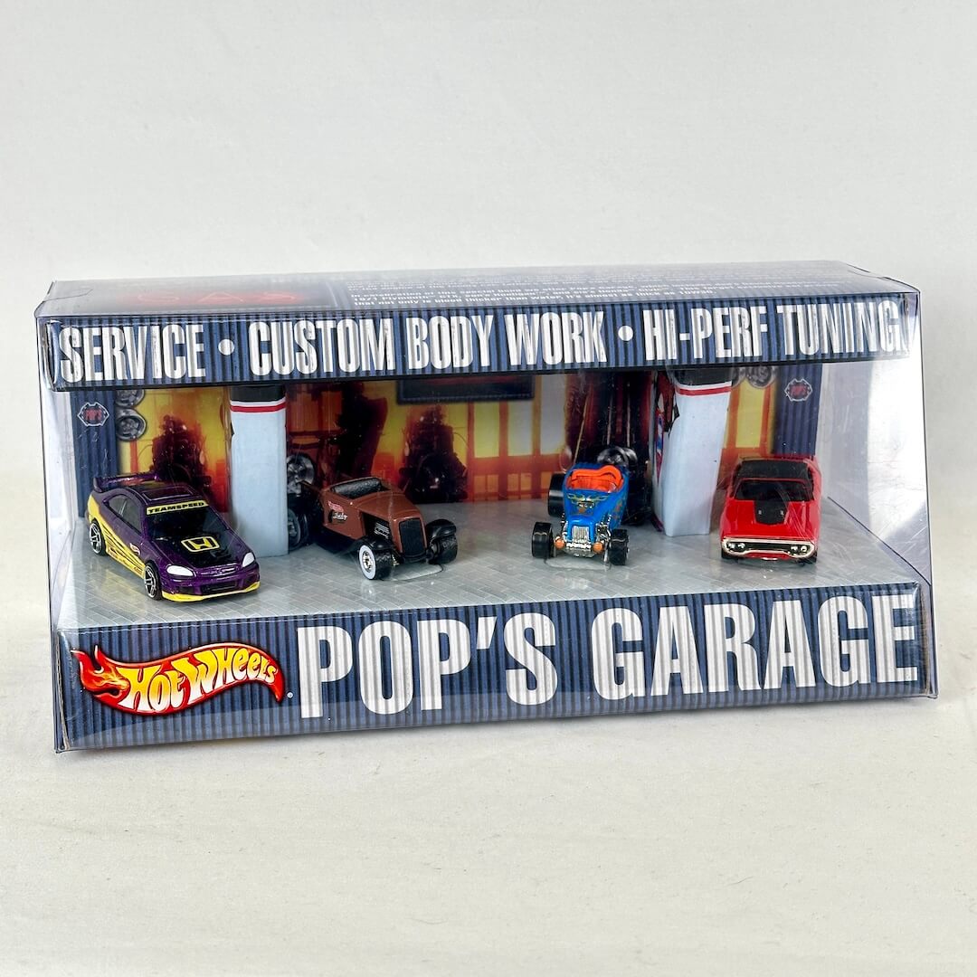 Hot Wheels Pop's Garage toy car display box containing four miniature cars.