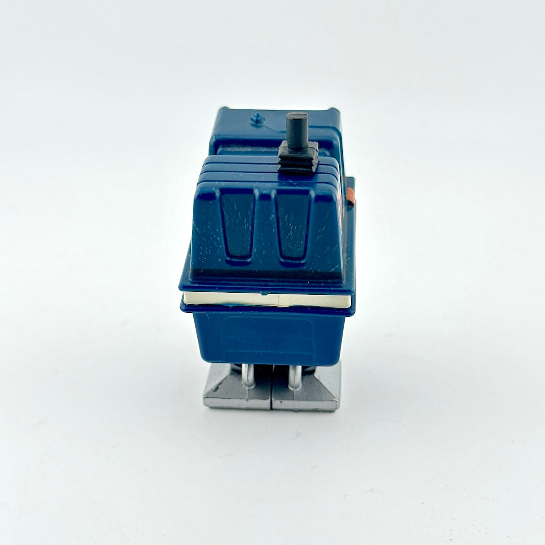 Blue toy robot on white background. 