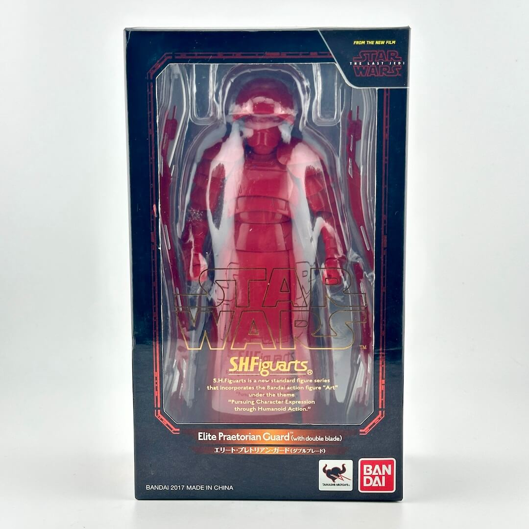 Star Wars action figure in black retail box with window showing figure in all red with accessories. 