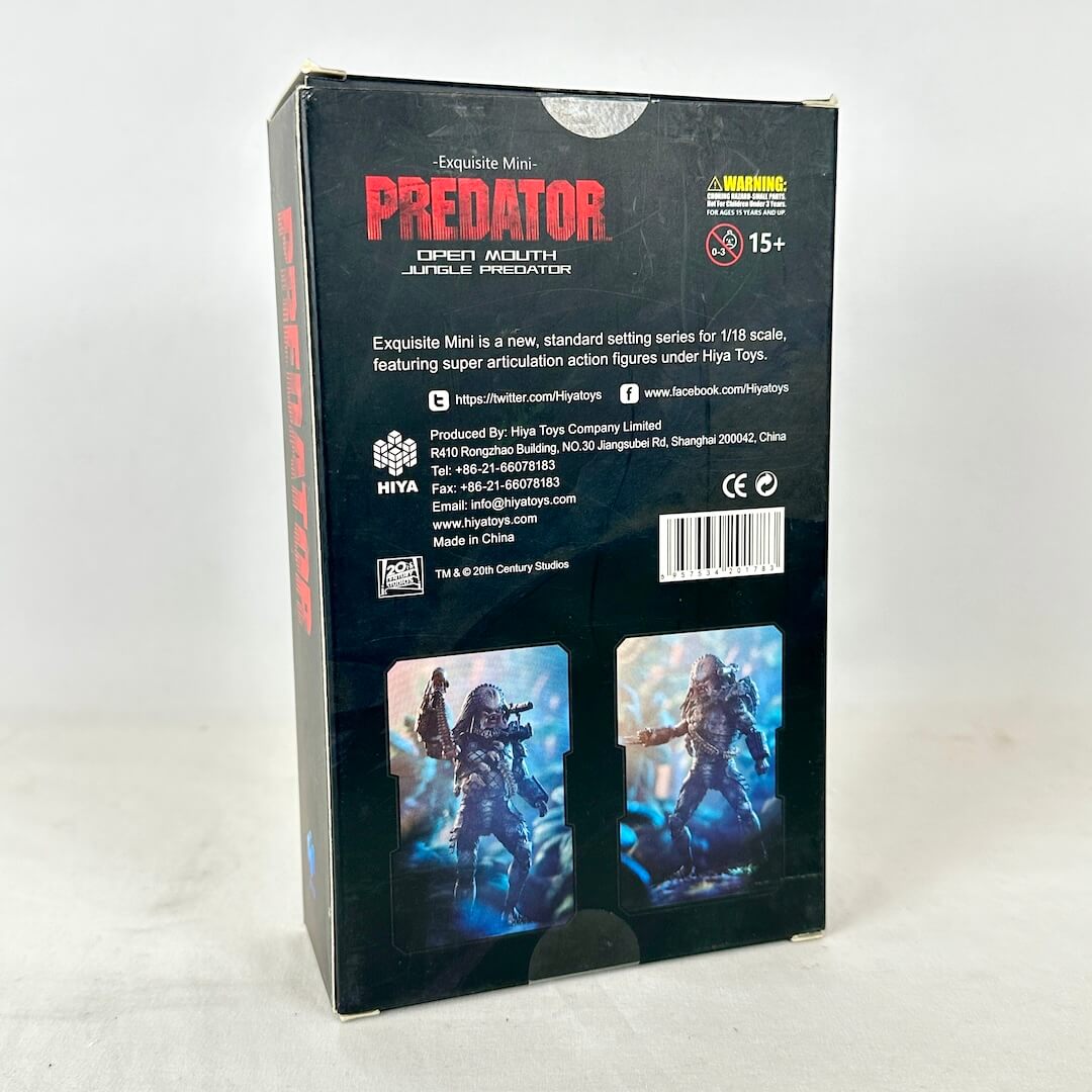 Back view of packaging with two illustrations of action figure and brief write up about product and warning label. 