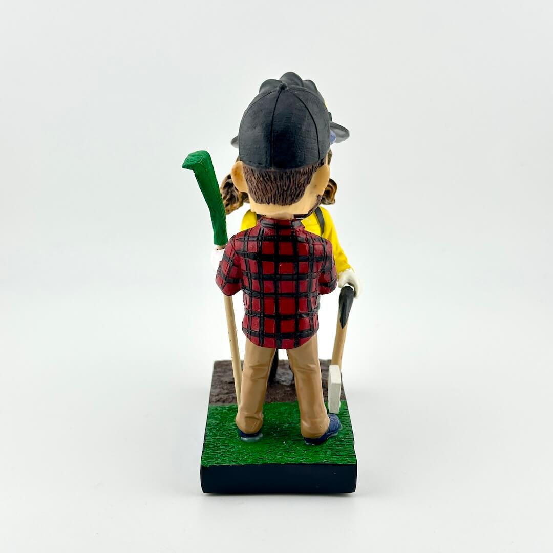 Bobbleheads of a man and woman in outdoor gear with 'Prevent Wildfires' text on a white background